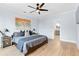 This primary bedroom features an en suite bathroom and lovely hardwood floors at 1671 Laurel Nw Ave, Atlanta, GA 30318