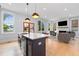 Open concept kitchen and living room boasts hardwood floors and ample natural light at 1671 Laurel Nw Ave, Atlanta, GA 30318