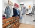 Walk-in closet with white wire shelving and a wood dresser for ample storage at 1671 Laurel Nw Ave, Atlanta, GA 30318