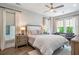 Inviting bedroom with hardwood floors, ceiling fan, neutral palette, lots of light and comfy furnishings at 175 Stovall Se St, Atlanta, GA 30316