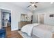 Well-lit bedroom with hardwood floors, walk-in closet, ceiling fan, and connected bathroom at 175 Stovall Se St, Atlanta, GA 30316
