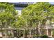 Beautiful exterior view of a townhome, featuring lush trees and a private balcony at 175 Stovall Se St, Atlanta, GA 30316