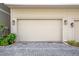 Spacious two car garage with neutral colored exterior and gray brick driveway at 175 Stovall Se St, Atlanta, GA 30316