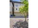 Three car garages with neutral colored exterior and gray brick driveway at 175 Stovall Se St, Atlanta, GA 30316