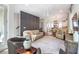 A well decorated living room with hardwood floors, multiple seating areas, and stairs nearby at 175 Stovall Se St, Atlanta, GA 30316