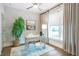 Bright home office featuring a desk, chair, large window, and neutral decor at 175 Stovall Se St, Atlanta, GA 30316