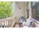 Cozy porch with outdoor seating, plants, and a view of lush greenery at 175 Stovall Se St, Atlanta, GA 30316