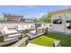 Inviting rooftop deck featuring an outdoor kitchen, comfortable seating, and artificial grass at 175 Stovall Se St, Atlanta, GA 30316