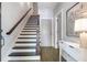 Beautiful staircase with hardwood steps, iron railings, and access to additional rooms at 175 Stovall Se St, Atlanta, GA 30316