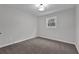 This room features carpeted floors, neutral walls, and a window, creating a cozy space at 2017 Allwood Ct, Lawrenceville, GA 30044