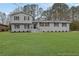 Charming split-level home featuring a well-maintained yard, gray brick, and symmetrical window design at 2017 Allwood Ct, Lawrenceville, GA 30044