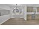 Charming eat-in kitchen featuring recessed lighting, gray cabinets, new stainless appliances and hardwood floors at 2017 Allwood Ct, Lawrenceville, GA 30044