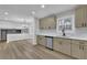 Updated kitchen with stainless appliances, quartz countertops and dining area, flowing into the living room at 2017 Allwood Ct, Lawrenceville, GA 30044