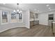Eat-in kitchen showcasing stainless steel appliances, new floors, updated cabinets, modern lighting and view to yard at 2017 Allwood Ct, Lawrenceville, GA 30044