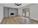 Spacious living room featuring fireplace, built in shelving, new flooring and access to backyard at 2017 Allwood Ct, Lawrenceville, GA 30044