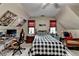 Bright bedroom with a black and white bed, warm-toned walls, and a ceiling fan, with windows at each end at 2130 Monticello Pl, Lawrenceville, GA 30043