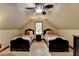 Upstairs bedroom with vaulted ceiling, carpet, and two twin beds with patterned linens at 2130 Monticello Pl, Lawrenceville, GA 30043