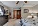 Carpeted bedroom with neutral colors, traditional dark dresser, sloped ceiling and doorway at 2130 Monticello Pl, Lawrenceville, GA 30043