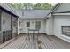 Back deck features a round table with access to screened porch and backyard at 2130 Monticello Pl, Lawrenceville, GA 30043