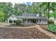 Charming two-story home with a brick walkway and well-maintained landscaping at 2130 Monticello Pl, Lawrenceville, GA 30043
