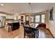Eat in kitchen with stainless steel appliances, island with seating and wood floors at 2130 Monticello Pl, Lawrenceville, GA 30043