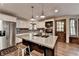 Kitchen with stainless appliances, central island, and wood floors at 2130 Monticello Pl, Lawrenceville, GA 30043