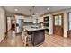 Stylish eat in kitchen with stainless steel appliances, central island, and pantry at 2130 Monticello Pl, Lawrenceville, GA 30043