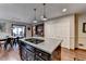 Open concept eat-in kitchen featuring large kitchen island with cooktop and pendant lighting at 2130 Monticello Pl, Lawrenceville, GA 30043