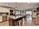 Open kitchen with granite countertops, stainless appliances, an island, and breakfast nook at 2130 Monticello Pl, Lawrenceville, GA 30043