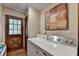 Functional laundry room with washer, dryer, and backyard access at 2130 Monticello Pl, Lawrenceville, GA 30043