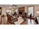 Cozy living room with a brick fireplace, hardwood floors, and comfortable seating at 2130 Monticello Pl, Lawrenceville, GA 30043