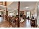 Spacious living room featuring hardwood floors, a brick fireplace, and staircase at 2130 Monticello Pl, Lawrenceville, GA 30043