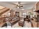 Living room features hardwood floors, a brick fireplace, and ample natural light at 2130 Monticello Pl, Lawrenceville, GA 30043