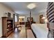 Luxurious main bedroom showcasing a four-poster bed, hardwood floors, and private ensuite at 2130 Monticello Pl, Lawrenceville, GA 30043