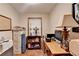 Cozy home office featuring a hardwood floor, natural light, and a desk space at 2130 Monticello Pl, Lawrenceville, GA 30043