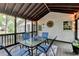 Enclosed porch with screened windows, outdoor seating, ceiling and string lights at 2130 Monticello Pl, Lawrenceville, GA 30043