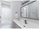 Bright bathroom with a tub/shower combo and black hardware at 630 Bluff Oak Ct, Roswell, GA 30076