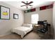 Bedroom with neutral walls, carpet floors, a ceiling fan, and a desk with an office chair at 630 Bluff Oak Ct, Roswell, GA 30076