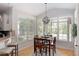 Dining area with hardwood floors and views of the backyard at 630 Bluff Oak Ct, Roswell, GA 30076