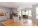 Eat-in kitchen featuring stainless steel appliances, bar seating, and an adjacent dining area with natural light at 630 Bluff Oak Ct, Roswell, GA 30076