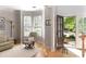 Bright living room with neutral decor, bay window and hardwood floors at 630 Bluff Oak Ct, Roswell, GA 30076