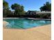 Community pool with clear blue water and ample deck space, providing a refreshing and relaxing amenity at 630 Bluff Oak Ct, Roswell, GA 30076