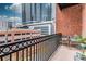 Private balcony featuring red brick detail and downtown city views at 850 Piedmont Ne Ave # 2509, Atlanta, GA 30308