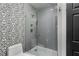 Modern bathroom with mosaic tile floor and glass enclosed shower at 850 Piedmont Ne Ave # 2509, Atlanta, GA 30308