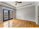 Bright bedroom with tray ceiling, hardwood floors, and private balcony access at 850 Piedmont Ne Ave # 2509, Atlanta, GA 30308