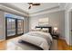 Serene bedroom with a balcony, hardwood floors, and plenty of natural light at 850 Piedmont Ne Ave # 2509, Atlanta, GA 30308