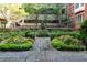 Serene courtyard with lush greenery, manicured gardens, and charming brick pathways for a tranquil outdoor escape at 850 Piedmont Ne Ave # 2509, Atlanta, GA 30308