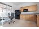 Functional kitchenette equipped with cabinets, appliances, and a cozy nook for office work at 850 Piedmont Ne Ave # 2509, Atlanta, GA 30308