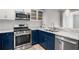 Stylish kitchen with blue cabinets, stainless steel appliances, and marble countertops at 850 Piedmont Ne Ave # 2509, Atlanta, GA 30308