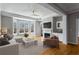 Cozy living room featuring a fireplace, modern furniture, and large windows at 850 Piedmont Ne Ave # 2509, Atlanta, GA 30308